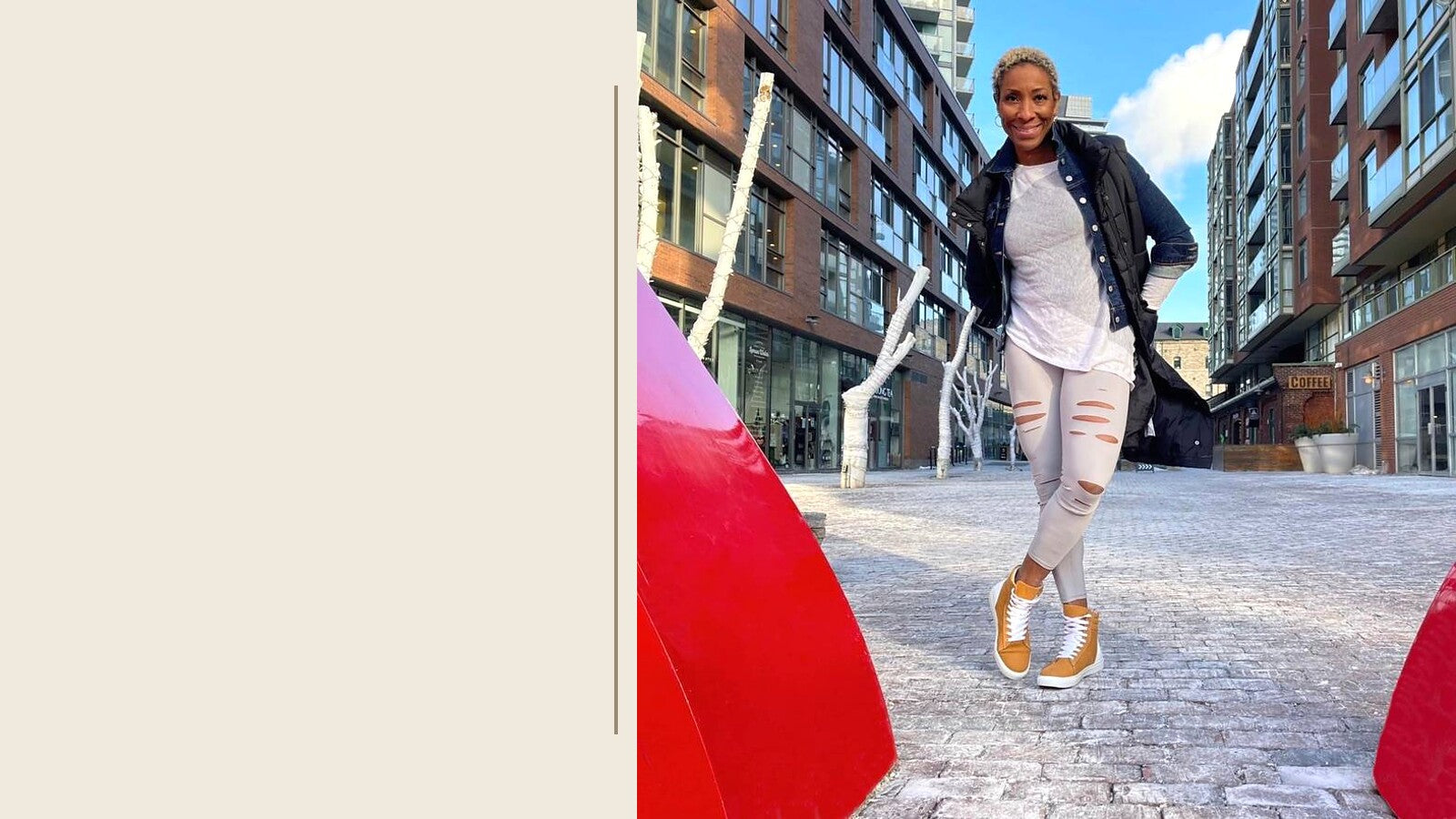 Judy Stewart wearing wheat-coloured Fraser high-top sneakers by Trèsolz on a city street.