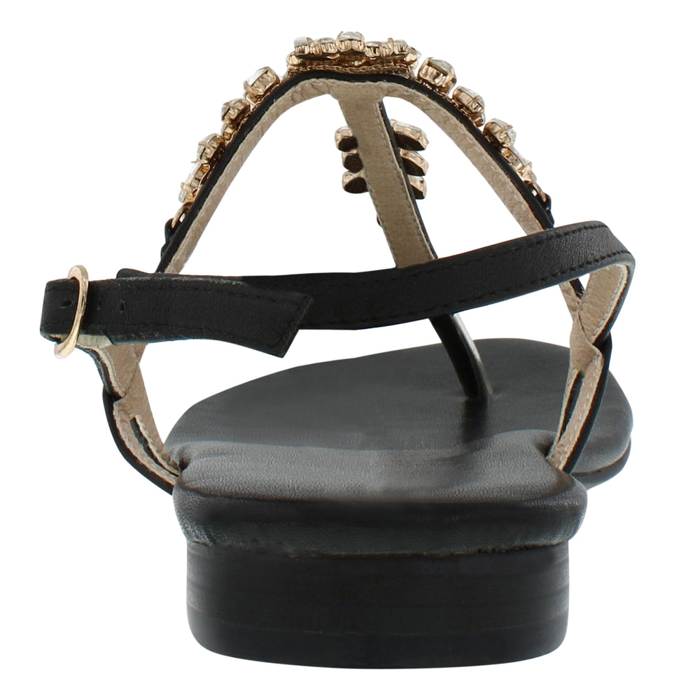 
                  
                    Load image into Gallery viewer, A back shot of a beautiful black women&amp;#39;s thong style sandal with a flat heel, sling back with buckle, and clear gemstones held with gold casing.
                  
                