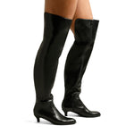 A woman's pair of legs in tall black over-the-knee boots with a small 2" heel and a full side zipper.